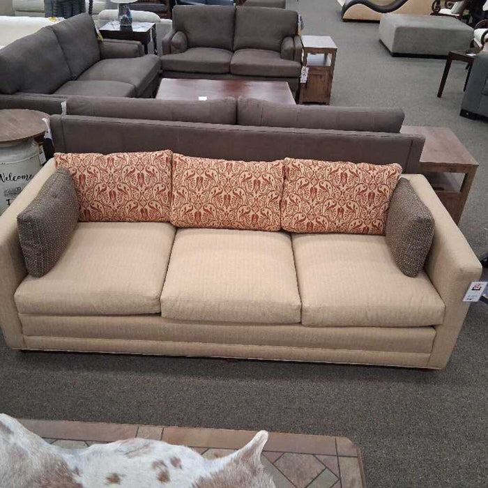 Tan Sofa w/ Red Pillows & Otto