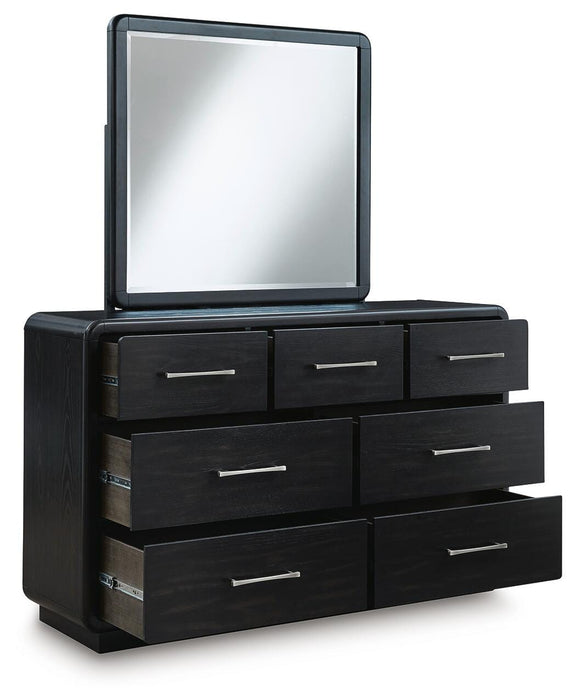 Rowanbeck California King Upholstered Panel Bed with Mirrored Dresser